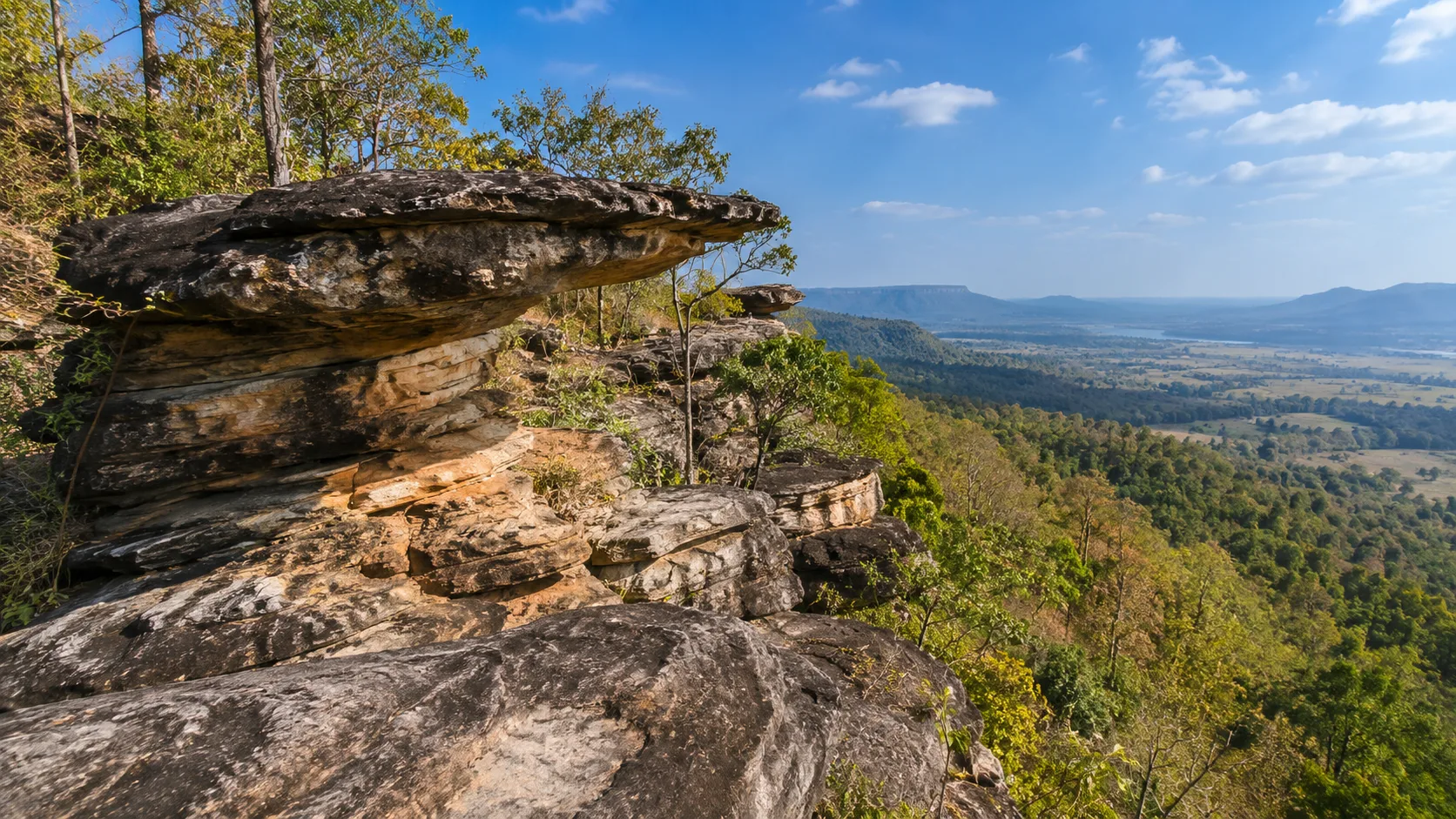 Sandstone overlook and forest scenery at Phu Foi Lom in Udon Thani.
