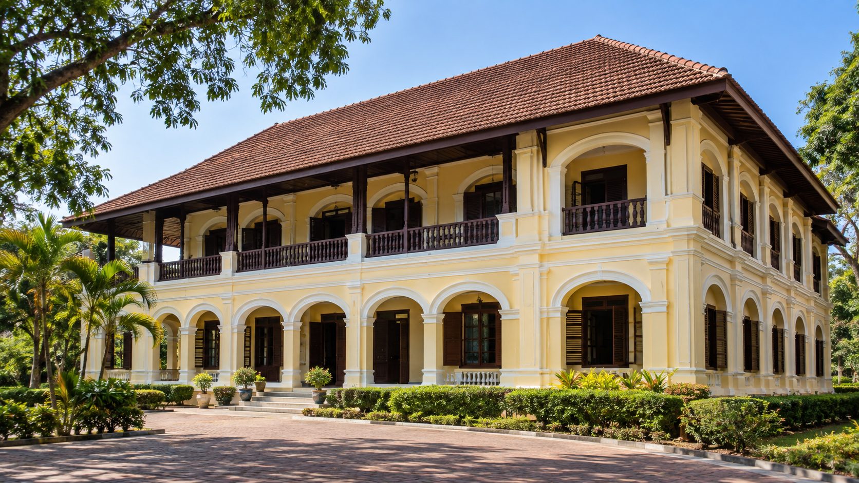 Colonial style arches and historic architecture of the Ratchinuthit Building at Udon Thani City Museum