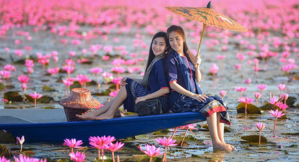 Discover Udon Thani Red Lotus Lake Two Women in a blue canoe