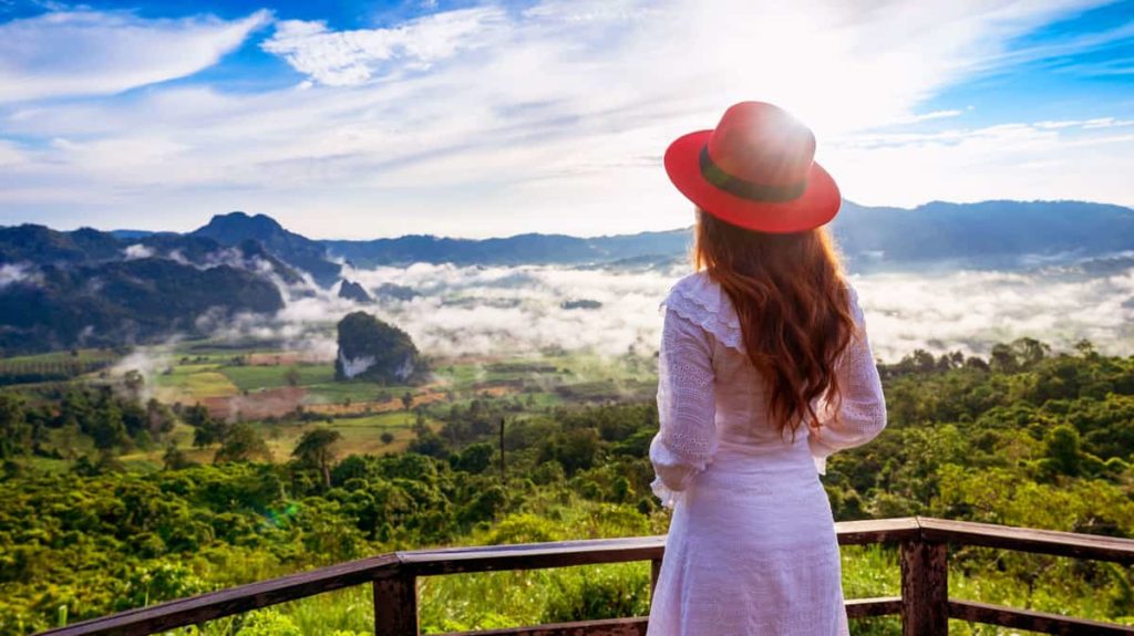 Woman Standing On Mountain in Udon Thani Province Looking at Misty Morning Valley