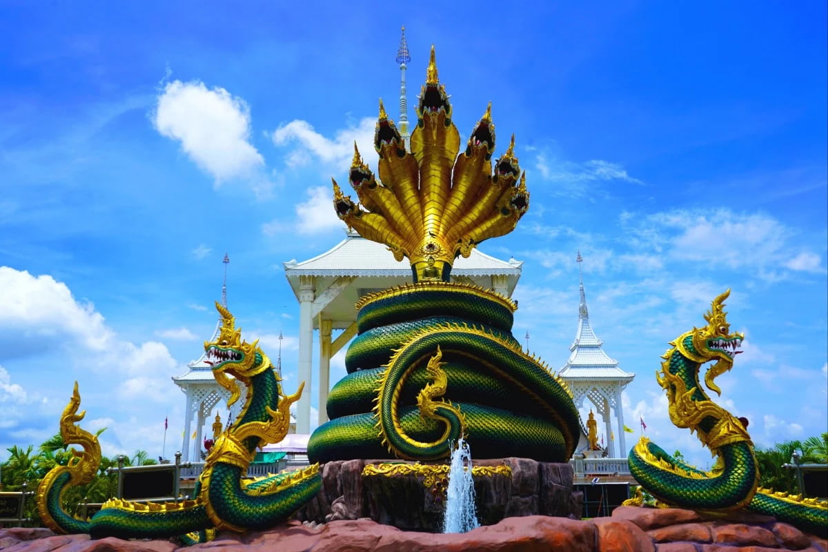 A detailed nine-headed Naga statue at Wat Wirachot Thammaram in Chachoengsao, Thailand, showing traditional Thai craftsmanship and symbolic guardian motifs commonly associated with Buddhist temples along the Mekong region