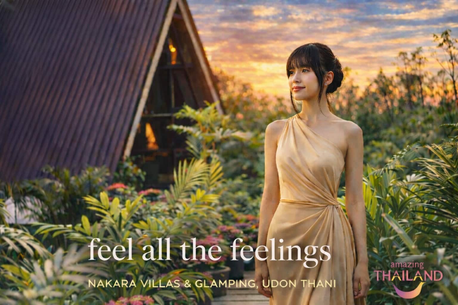 Woman standing in tropical garden at sunset in front of A-frame villa at Nakara Villas & Glamping, Udon Thani Thailand.